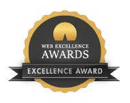 Web Excellence Awards badge featuring an Excellence Award with a gold seal in the center, surrounded by a black circular band with the text 'Web Excellence Awards' at the top and 'Excellence Award' at the bottom, all framed by a black ribbon with gold edges.